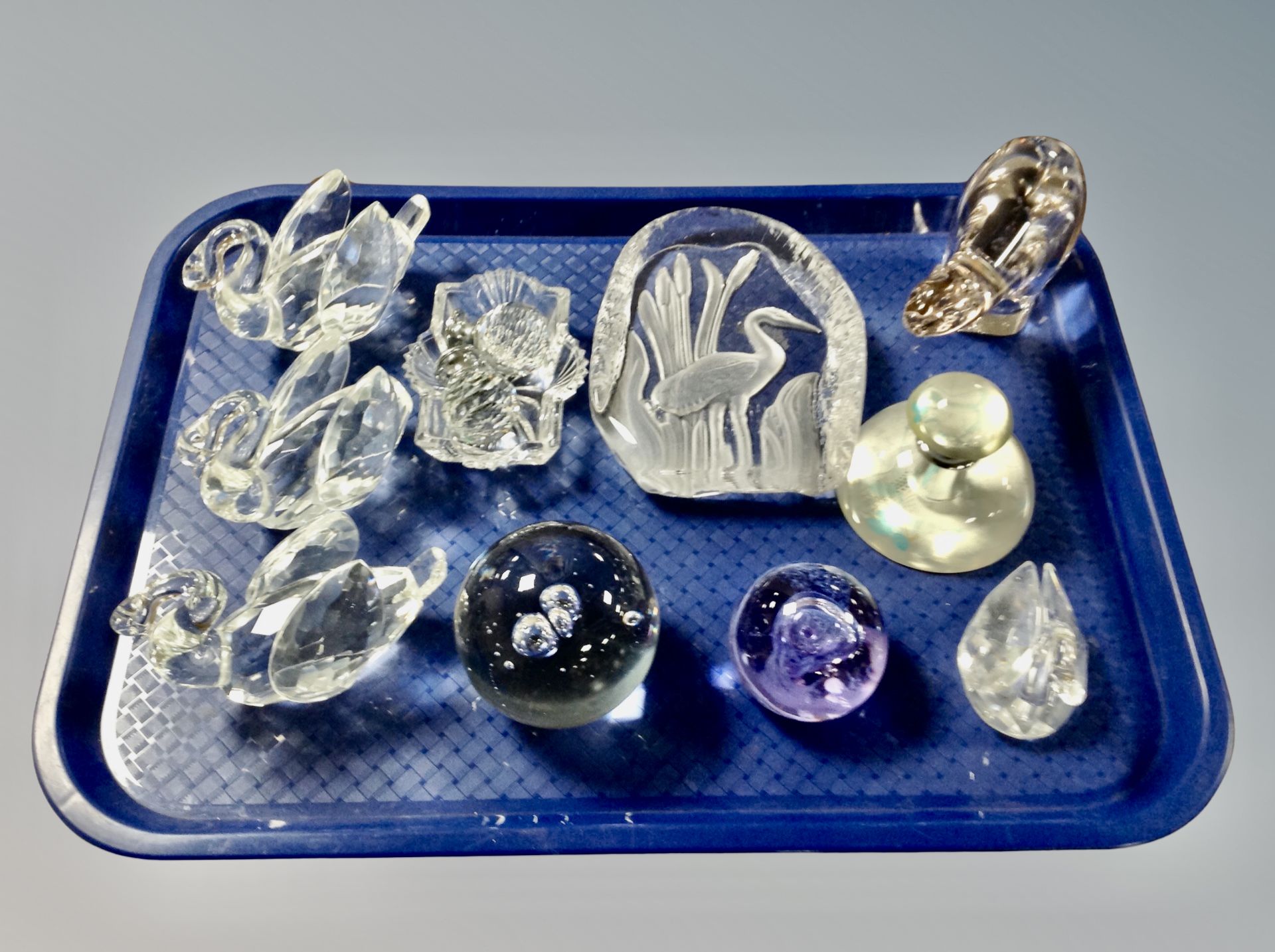 A tray of collection of glass and crystal paperweights and animal ornaments