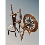 An oak spinning wheel together with an Arts & Crafts chair