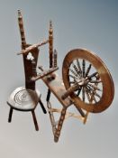 An oak spinning wheel together with an Arts & Crafts chair