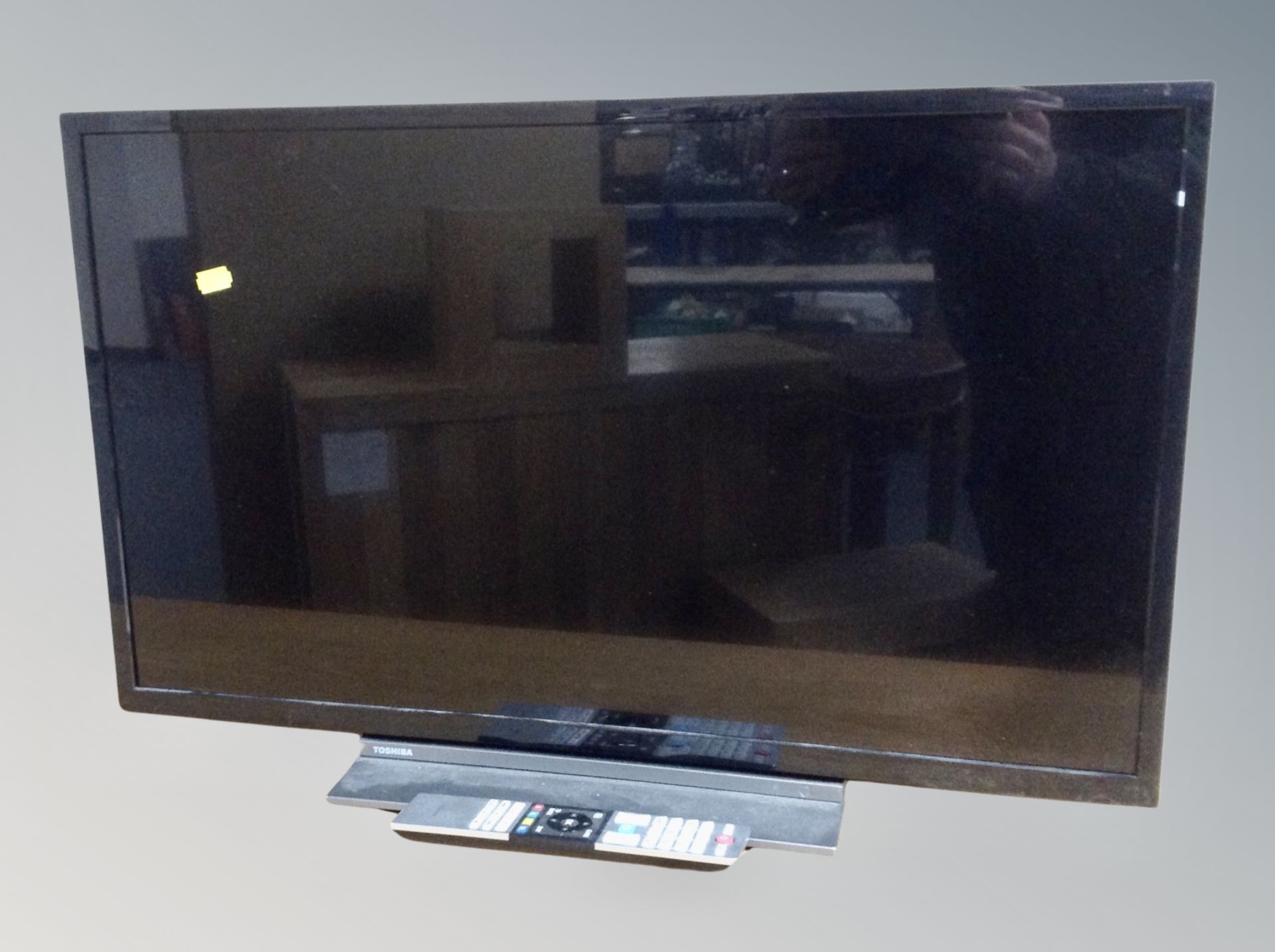 A Toshiba 32 inch LCD smart TV with remote model 32LL3A63BB (no plug)