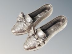 A pair of silver shoes