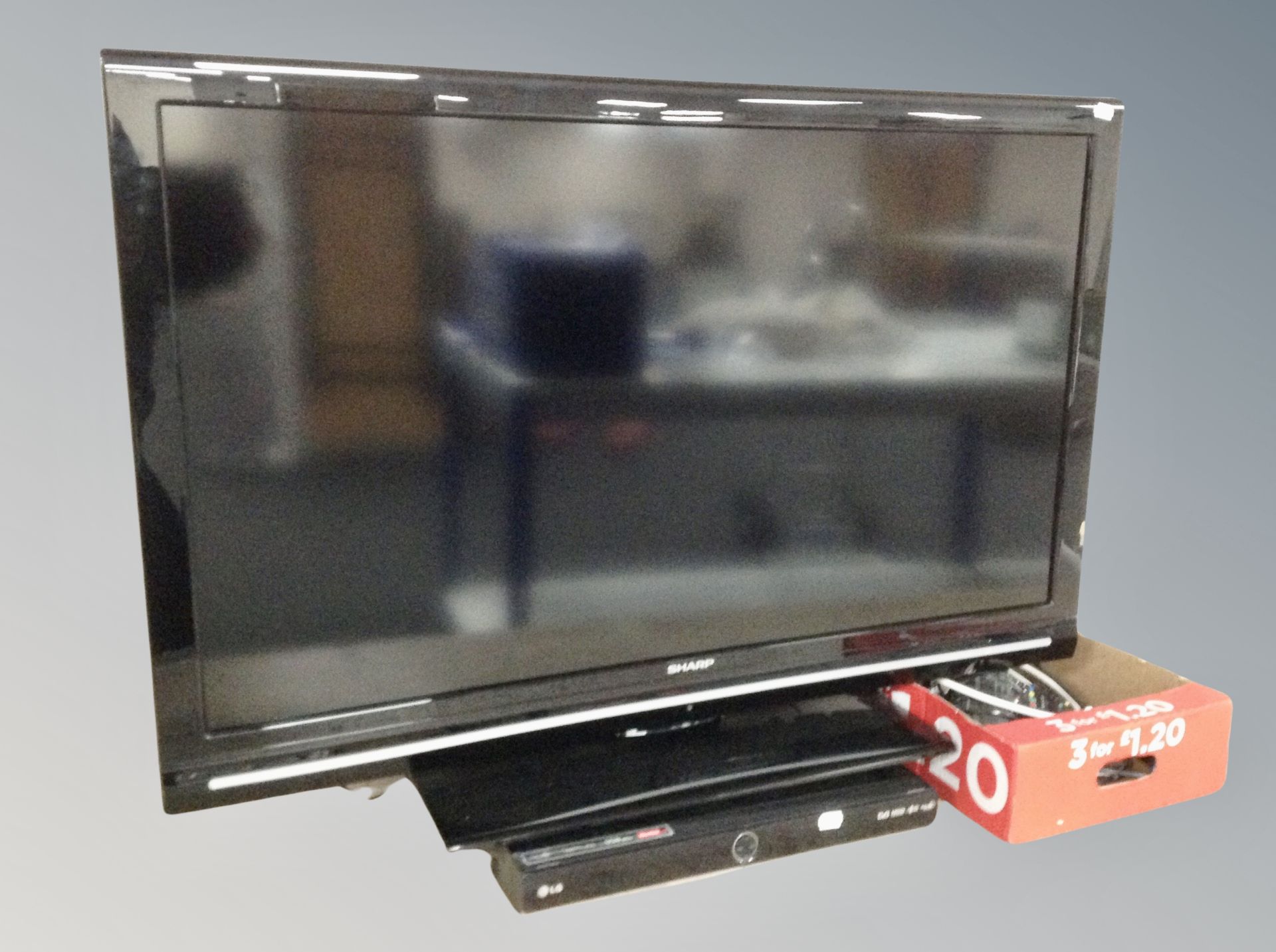 A Sharp 40 inch LCD TV with lead and remote together with an LG HDD DVD player with remote