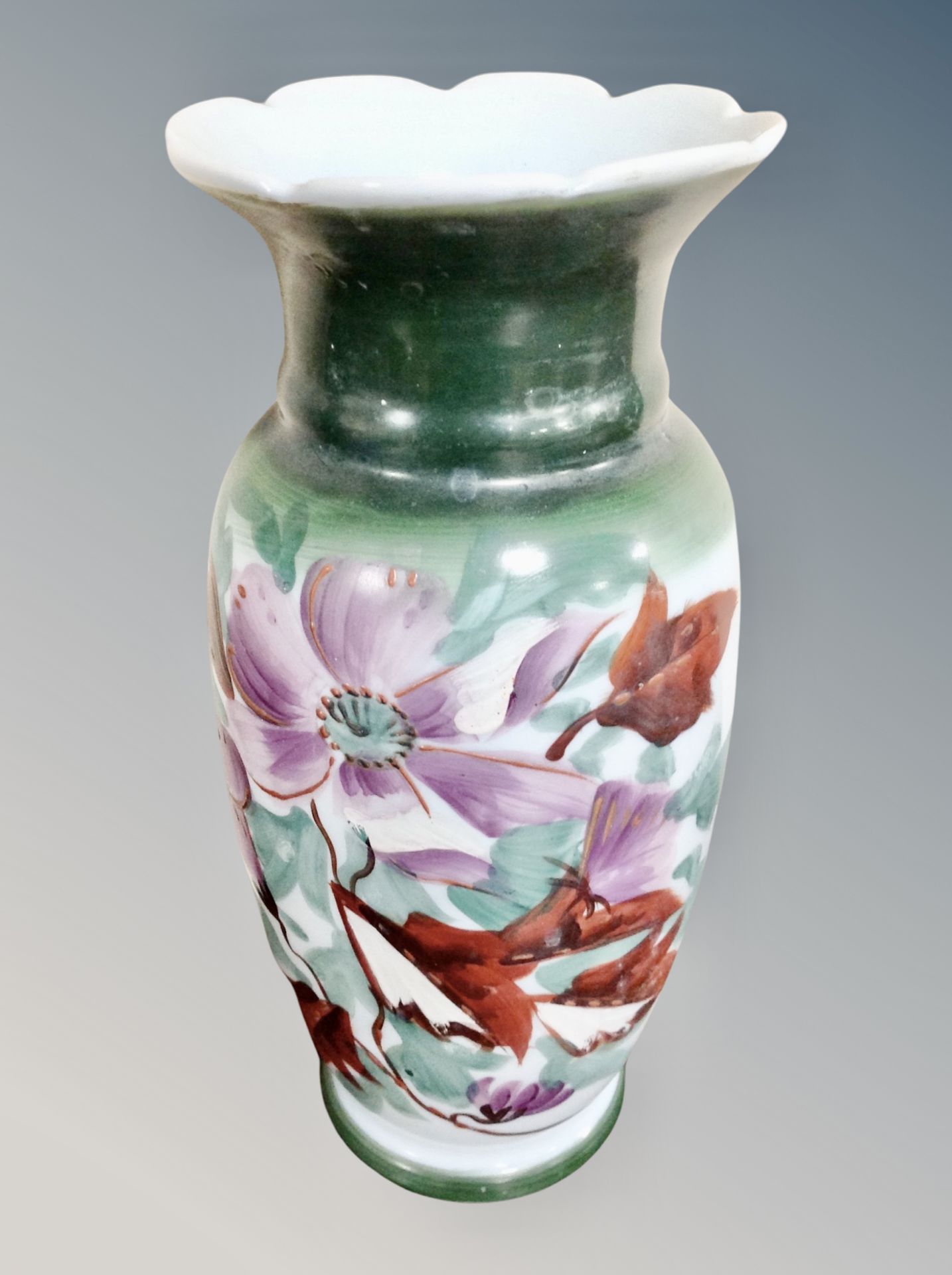 A Victorian hand painted glass vase, with floral decoration,