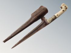 A 19th century Indo-Persian Pesh Kabz knife in leather sheath