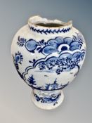 An antique Delft vase, as found,