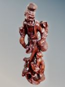 A carved Chinese wooden figure of a fisherman,