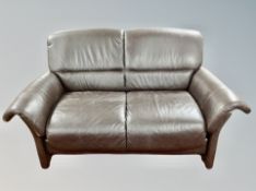 A Danish brown leather two seater settee