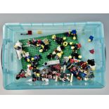 A small plastic storage box with lid containing vintage Lego mini figures,