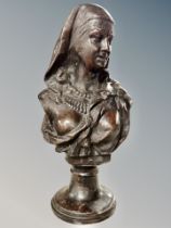 A 20th century bronze bust of a lady wearing a head scarf,