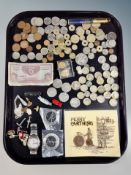 A tray of assorted foreign and British coins, British Armed Forces one pound note,