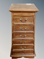 A six drawer graduated pyramid chest