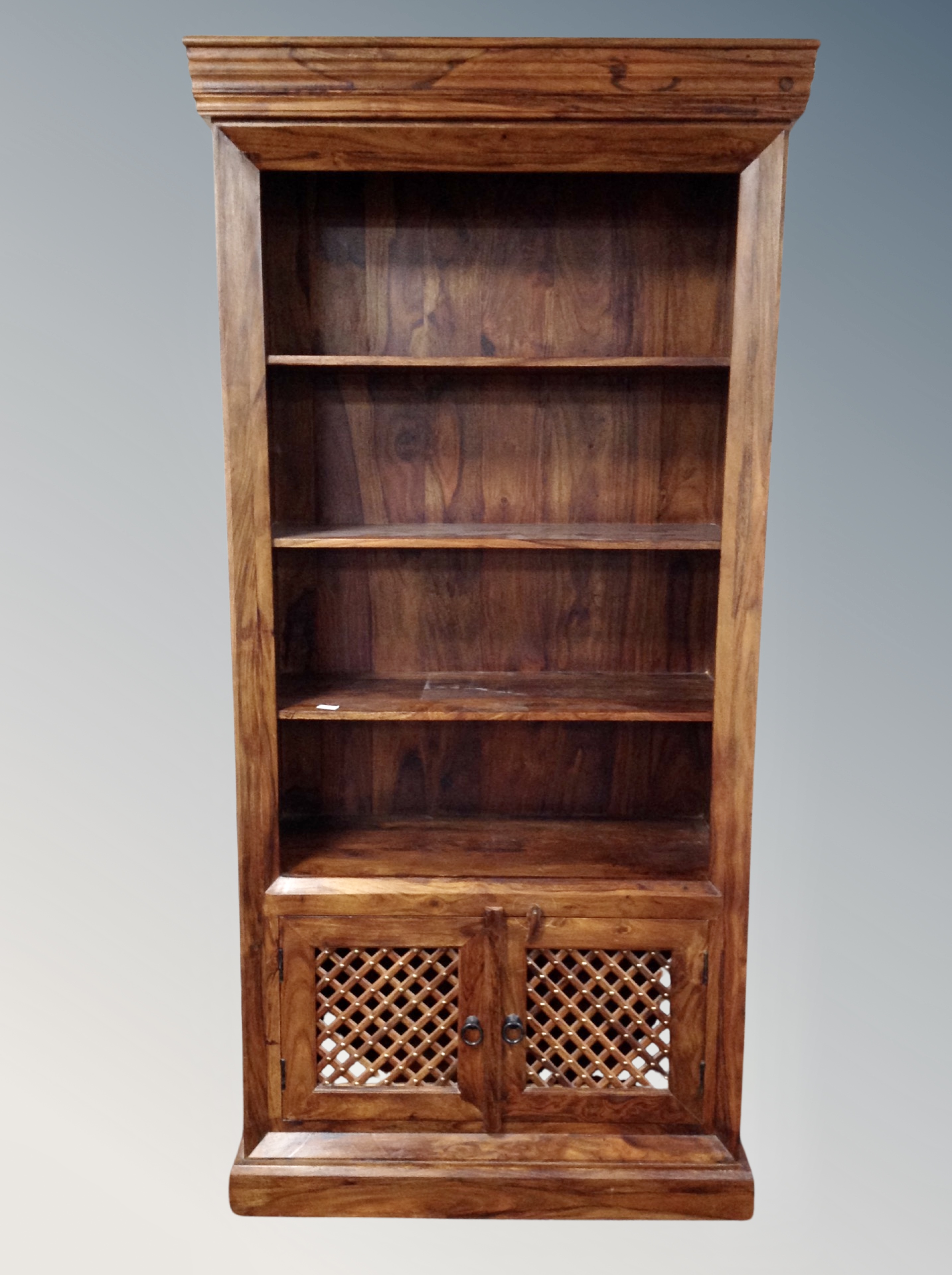 A set of sheesham wood open bookshelves