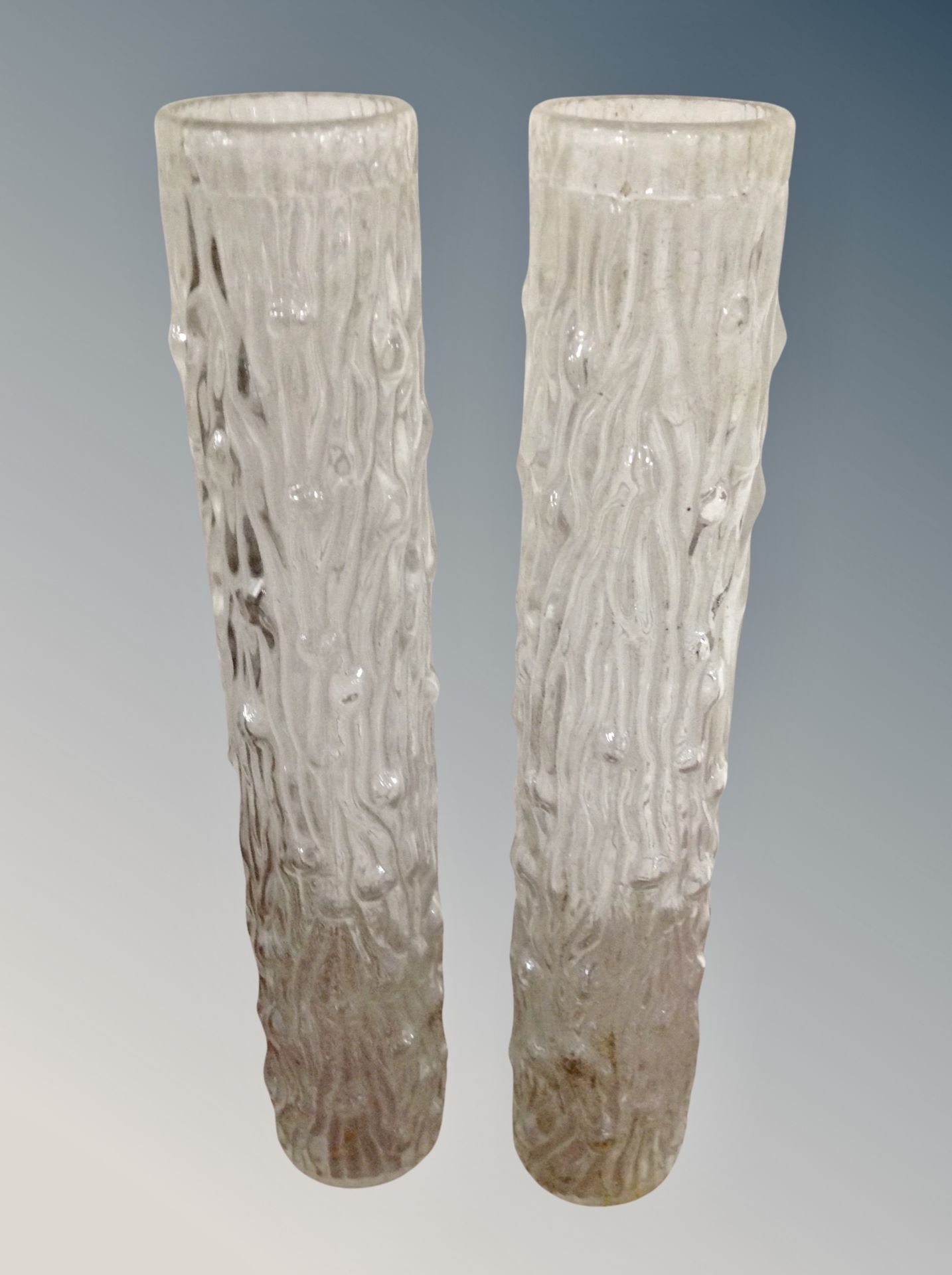 A pair of tall glass vases with bark effect finish, from Helsinki, 30.