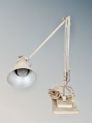 A vintage angle poise table lamp on square base