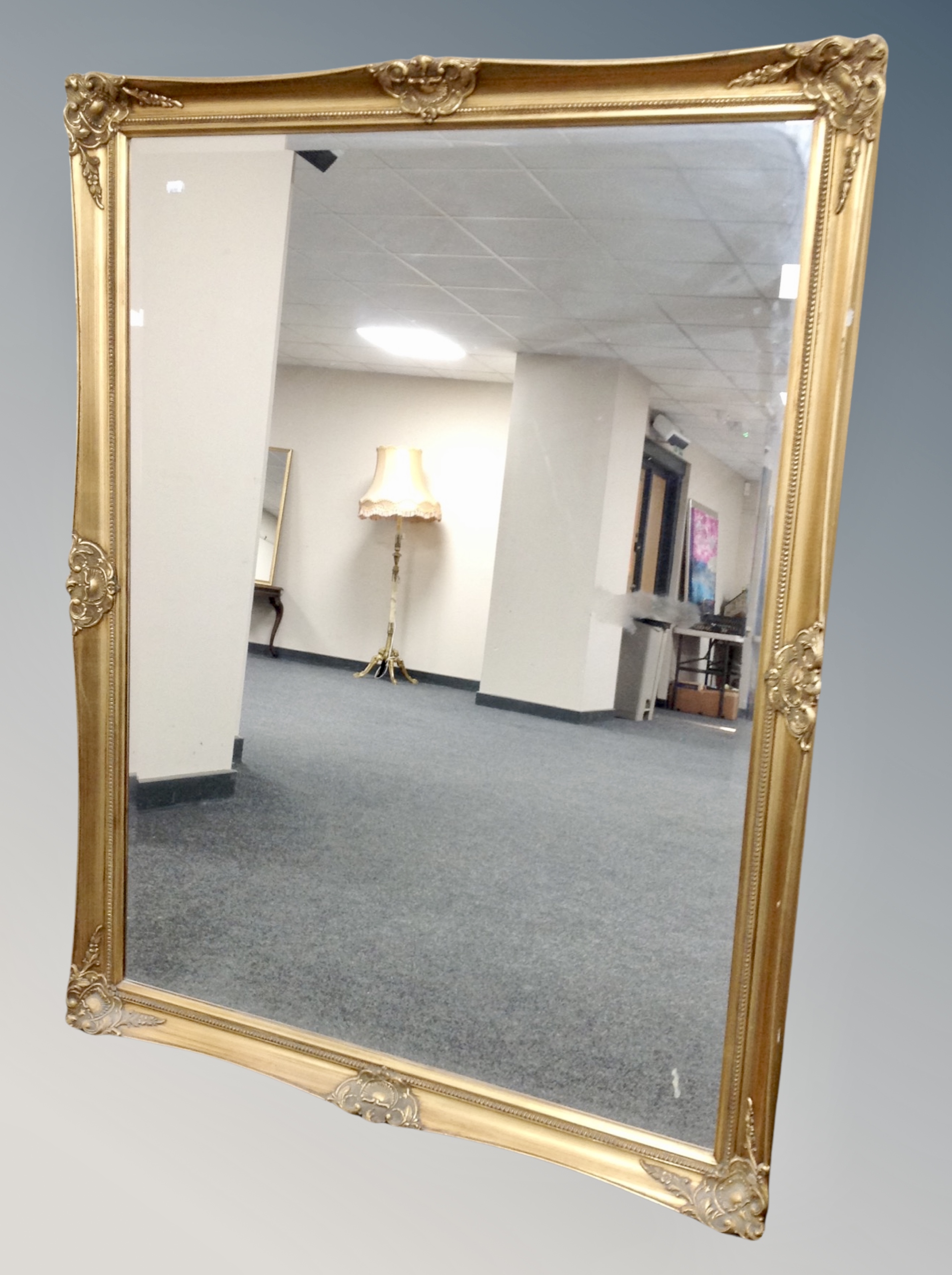 A contemporary gilt bevelled mirror,