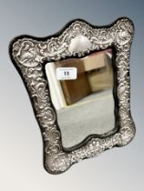 A silver embossed easel mirror, 23 cm x 29.