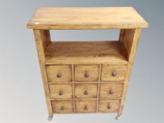 A contemporary oak side cabinet fitted with nine drawers