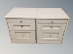 A pair of contemporary two drawer bedside chests with slide
