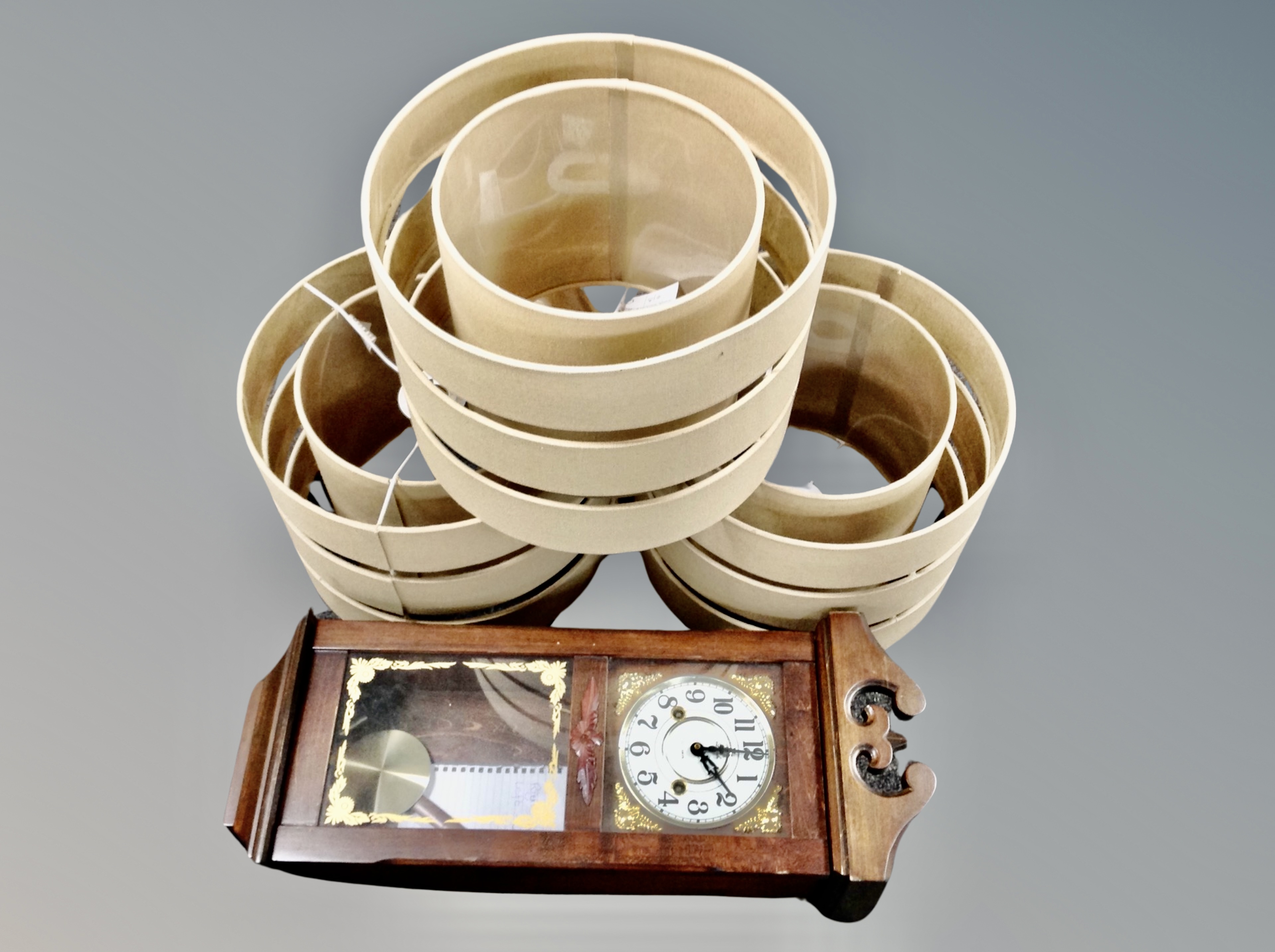 A Lincoln 31 day wall clock together with three contemporary lamp shades