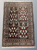 An Afghan/Caucasian rug,