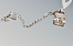 A 9ct white gold square pendant with white stone