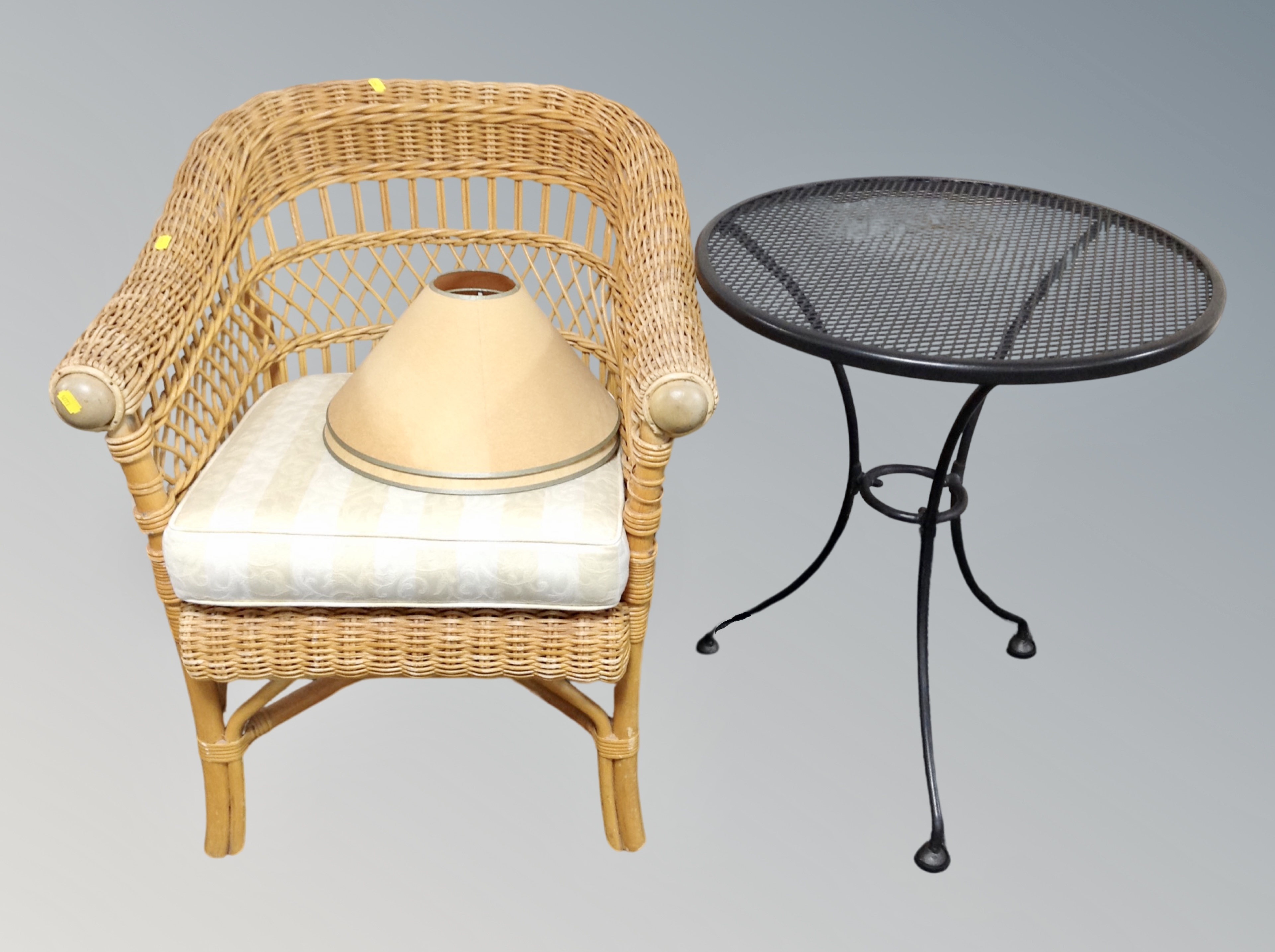 A bamboo and wicker conservatory armchair together with a metal bistro style table and two lamp