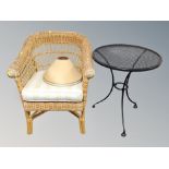 A bamboo and wicker conservatory armchair together with a metal bistro style table and two lamp
