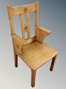 An oak ecclesiastical armchair