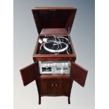 A mahogany gramophone cabinet containing Rotel RP 310 turntable,