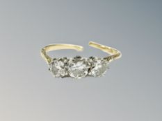 An 18ct gold and platinum three stone diamond ring (shank broken) CONDITION REPORT: