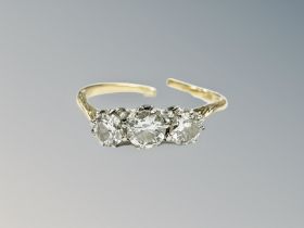 An 18ct gold and platinum three stone diamond ring (shank broken) CONDITION REPORT: