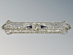 A 14ct white gold Art Deco sapphire and diamond brooch, length 55mm.