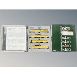 A Kato N scale 106/024 smooth side passenger four car set