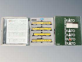 A Kato N scale 106/024 smooth side passenger four car set