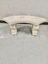 A concrete crescent shaped garden bench height 41 cm