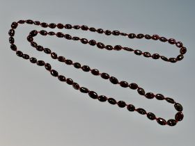 A garnet bead necklace,