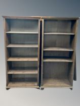 A pair of stained pine open bookcases,