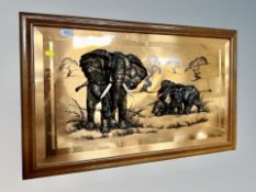 A copper finished relief panel depicting African elephants,