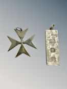 A heavy silver ingot pendant with engine turned decoration, length 5cm, and a silver Maltese Cross.