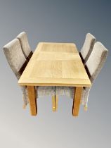 A Oak Furniture Land contemporary oak extending dining table with leaf,