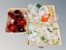 Three boxes of 20th century glass ware, ships decanter, ruby glass ware, oversized wine goblets,
