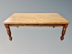 A Victorian style stained pine dining table,