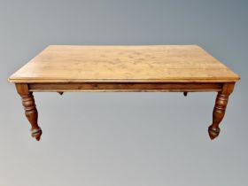 A Victorian style stained pine dining table,