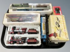 A group of HO scale die cast locomotives and model locomotives on plinths,