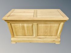 A contemporary oak blanket box,