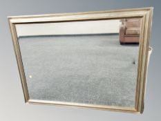 A contemporary bevelled overmantle mirror in silvered frame 114 cm x 89 cm