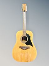 An Italian 12 string acoustic guitar labelled model KD28-D12, together with a guitar effects pedal,