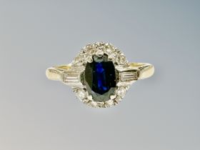 An 18ct gold sapphire and diamond cluster ring,