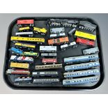 A group of unboxed N scale locomotives and rolling stock including Atlas,