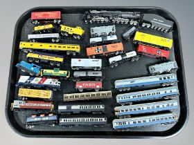 A group of unboxed N scale locomotives and rolling stock including Atlas,